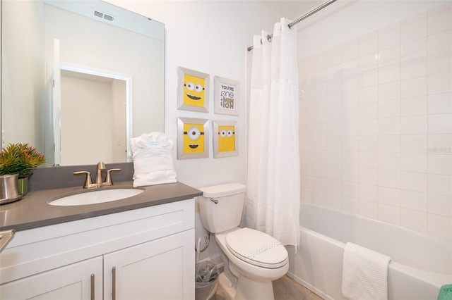 full bathroom featuring shower / tub combo, vanity, and toilet