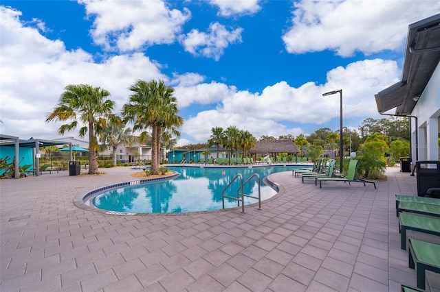 view of swimming pool with a patio area