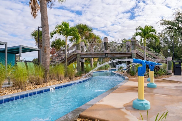 view of swimming pool featuring a patio and pool water feature