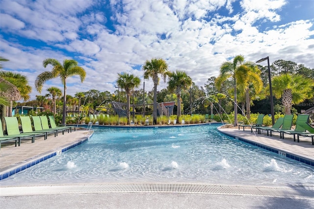 view of pool featuring pool water feature and a patio area