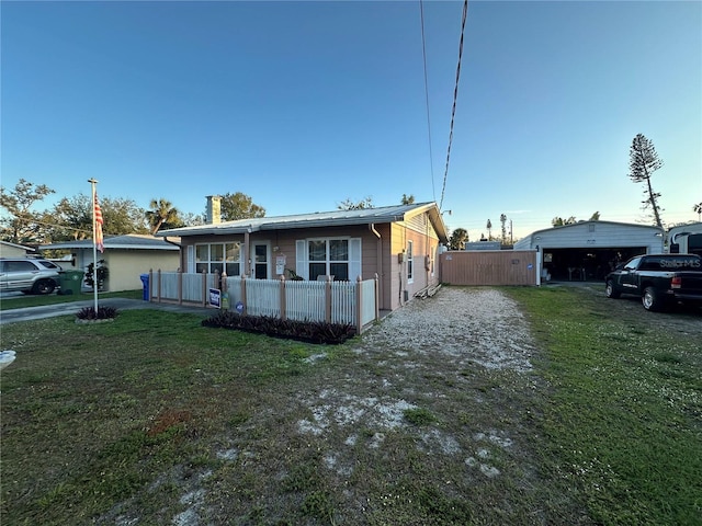 view of front of home with a porch and a front lawn