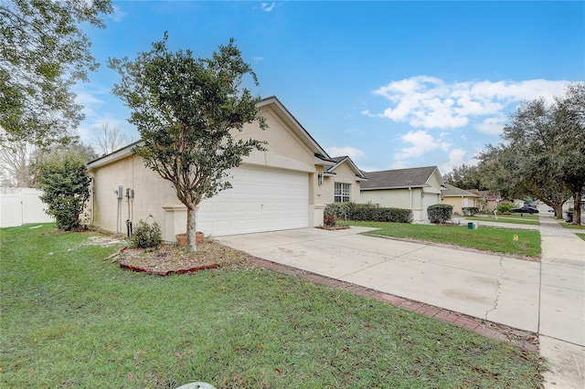 ranch-style home with a garage and a front yard