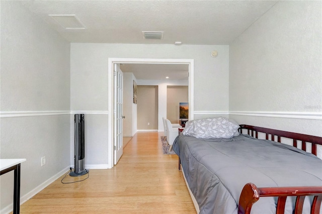 bedroom with light hardwood / wood-style floors