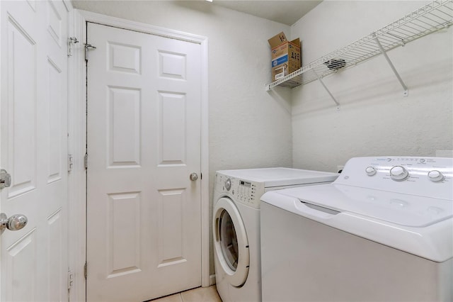 washroom with separate washer and dryer