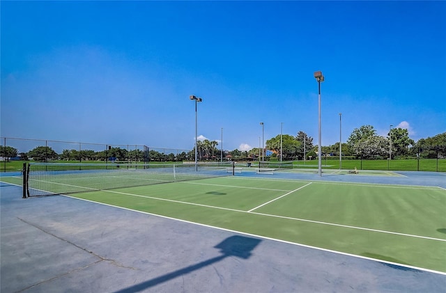 view of tennis court featuring basketball court