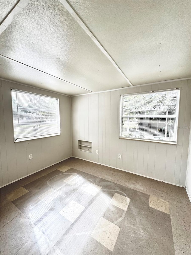 empty room featuring a textured ceiling