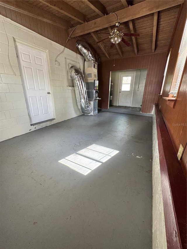 unfurnished room featuring vaulted ceiling and heating unit