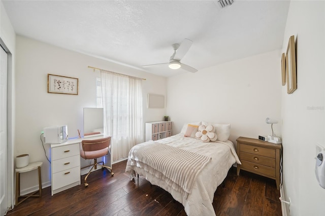 bedroom with dark wood-type flooring and ceiling fan