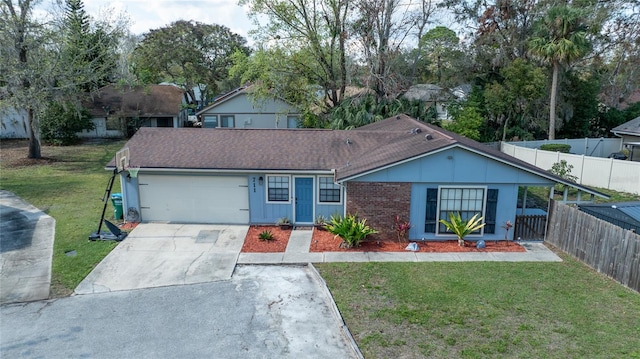 ranch-style home with a garage and a front lawn