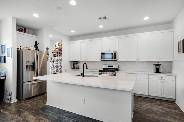 14214 Shocklach Dr, Winter Garden, FL 34787 - kitchen featuring visible vents, a sink, backsplash, and stainless steel appliances