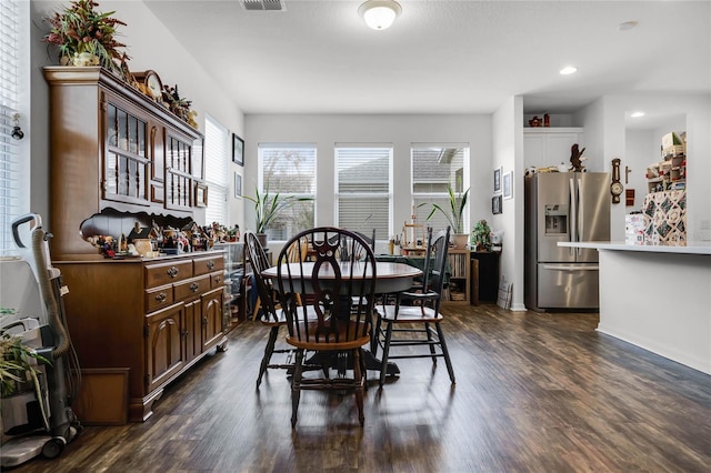 14214 Shocklach Dr, Winter Garden, FL 34787 - dining space with recessed lighting, baseboards, visible vents, and dark wood-style floors