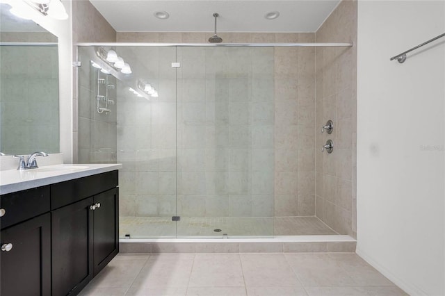 14214 Shocklach Dr, Winter Garden, FL 34787 - full bathroom featuring tile patterned floors, a shower stall, and vanity