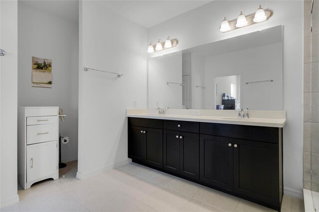 14214 Shocklach Dr, Winter Garden, FL 34787 - full bathroom featuring double vanity, a sink, baseboards, and tile patterned floors