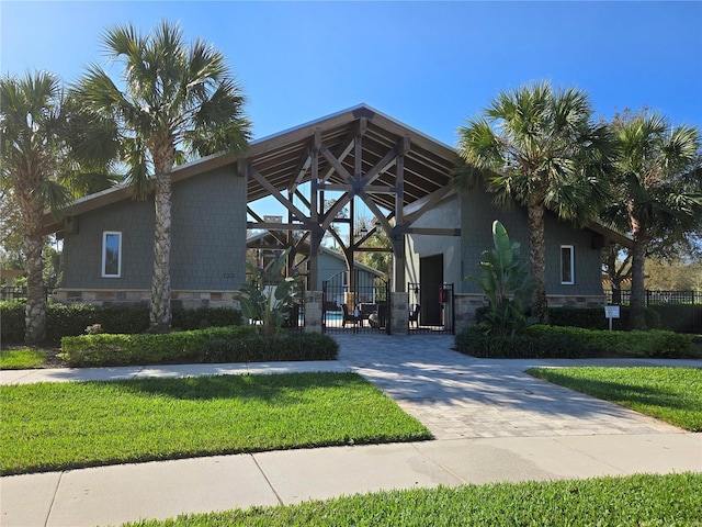14214 Shocklach Dr, Winter Garden, FL 34787 - view of front of property featuring fence, a gate, decorative driveway, and a front yard