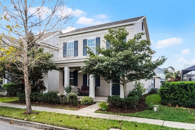 14214 Shocklach Dr, Winter Garden, FL 34787 - view of front facade with a porch and stucco siding