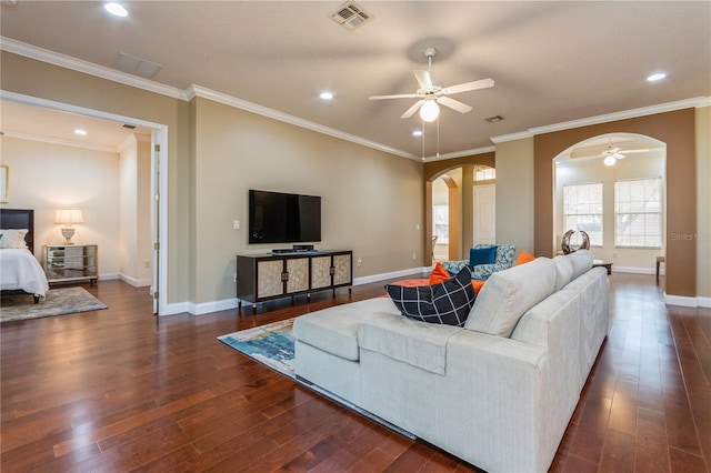 living room featuring crown molding, dark hardwood / wood-style floors, and ceiling fan