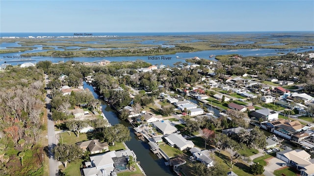 bird's eye view featuring a water view and a residential view