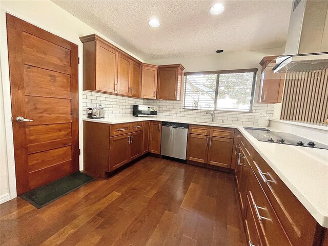 kitchen with black electric stovetop, extractor fan, a sink, dark wood-style floors, and dishwasher