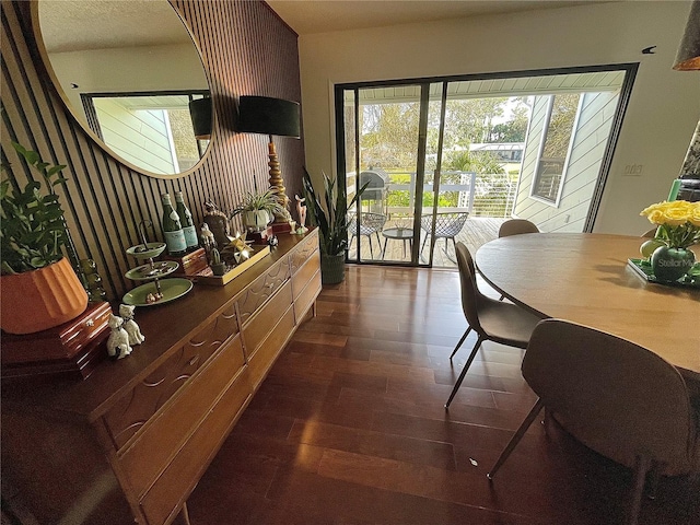 dining area featuring dark wood finished floors