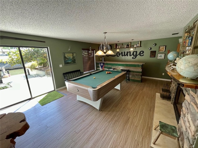 rec room featuring visible vents, a textured ceiling, wood finished floors, billiards, and baseboards