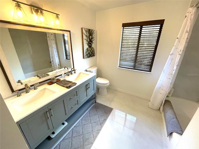 full bath featuring double vanity, shower / bath combo, a sink, and toilet