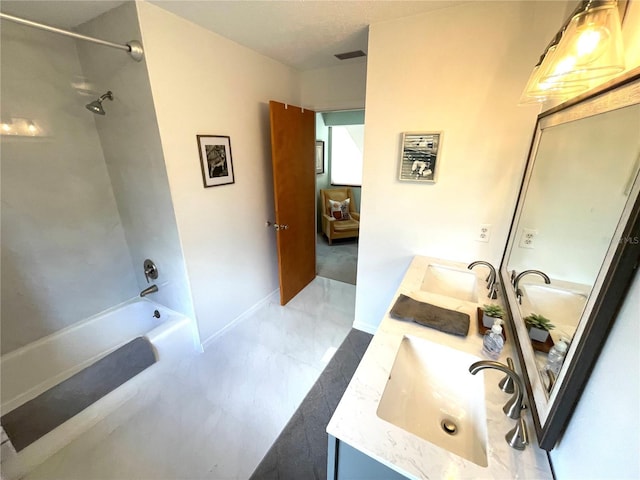 full bath featuring double vanity, visible vents, shower / tub combination, marble finish floor, and a sink