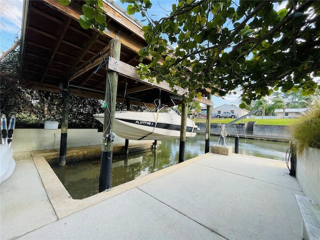 view of dock with a water view and boat lift