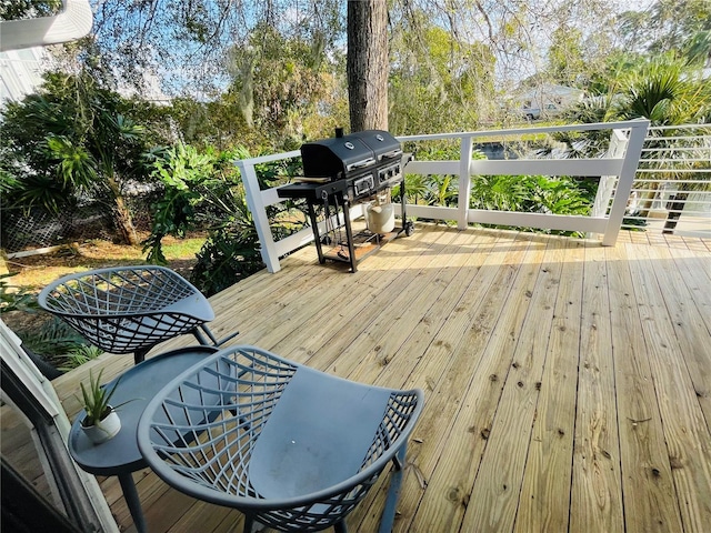 wooden deck with area for grilling