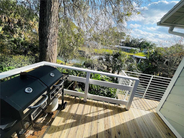 wooden terrace featuring grilling area