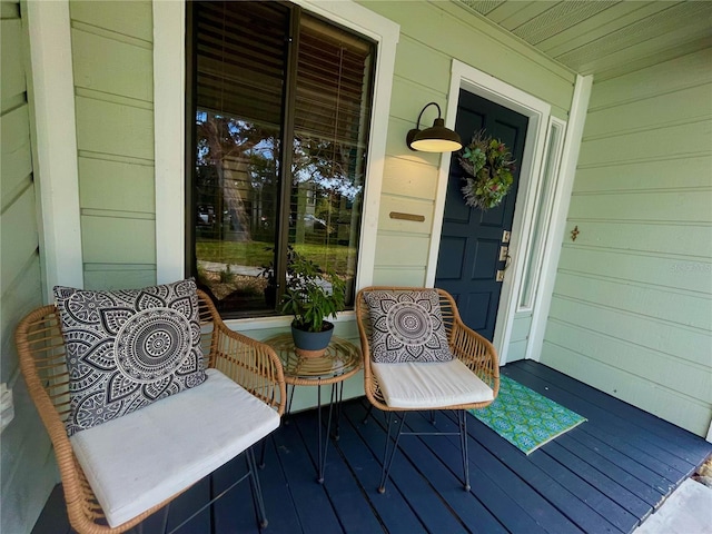 wooden terrace with a porch