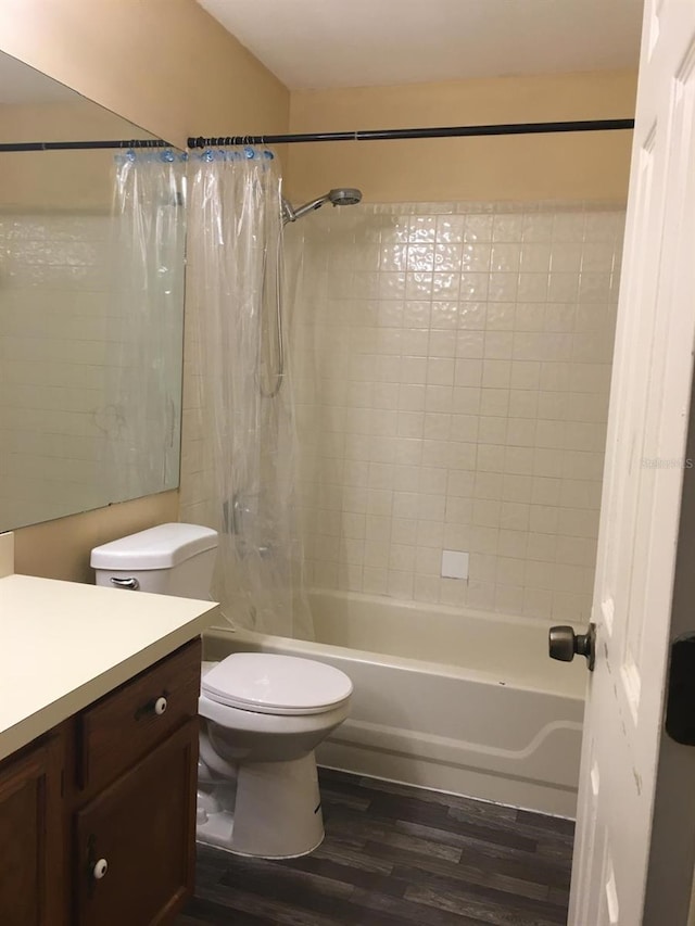 full bathroom with hardwood / wood-style flooring, vanity, toilet, and shower / tub combo with curtain