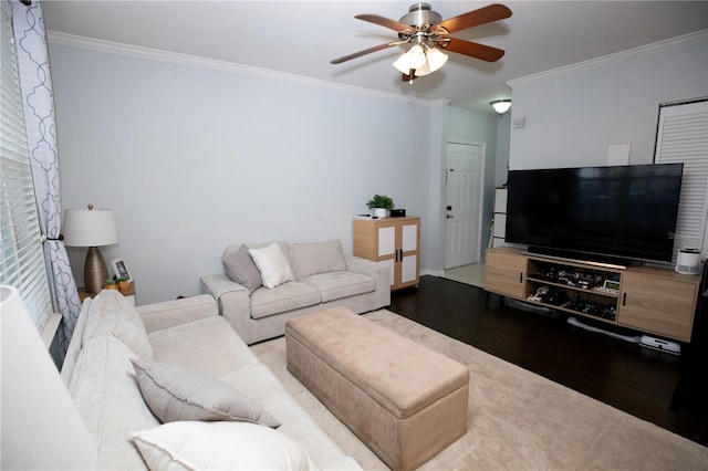 living room featuring crown molding, ceiling fan, and hardwood / wood-style flooring