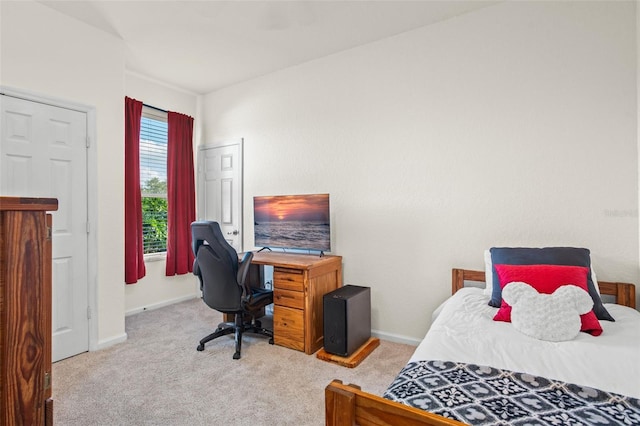 bedroom featuring light carpet