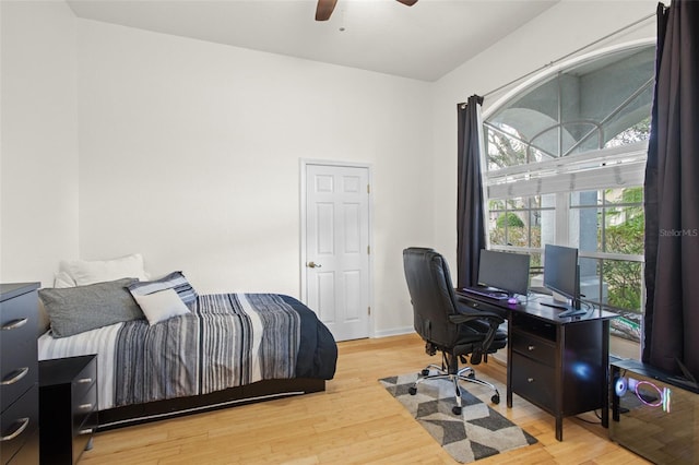 bedroom featuring wood-type flooring and ceiling fan