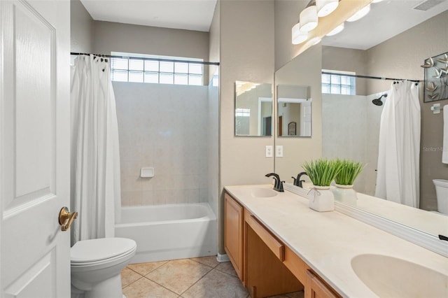 full bathroom featuring shower / bathtub combination with curtain, vanity, tile patterned flooring, and toilet