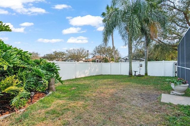 view of yard with a lanai