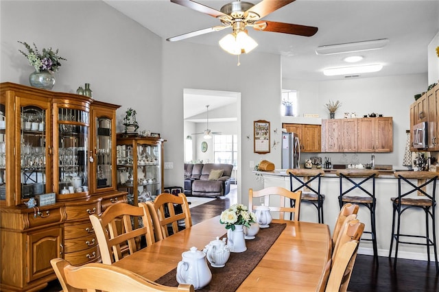 dining room featuring ceiling fan and dark hardwood / wood-style floors