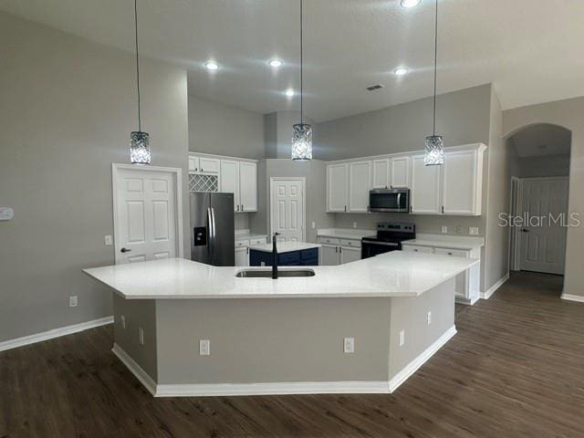 kitchen featuring stainless steel appliances, light countertops, and a large island