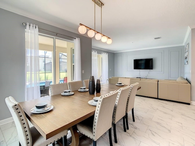 dining space featuring ornamental molding