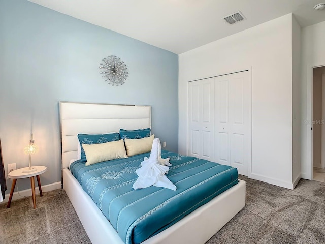 bedroom with a closet and carpet