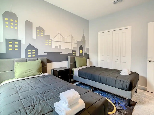 carpeted bedroom featuring a closet