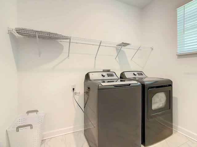 washroom featuring independent washer and dryer