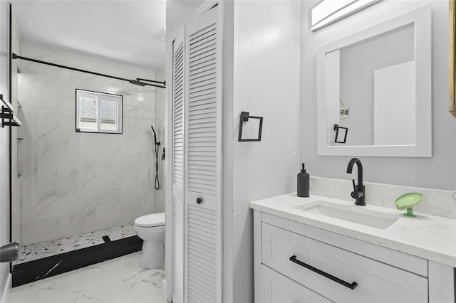 full bathroom featuring toilet, vanity, marble finish floor, a closet, and a marble finish shower