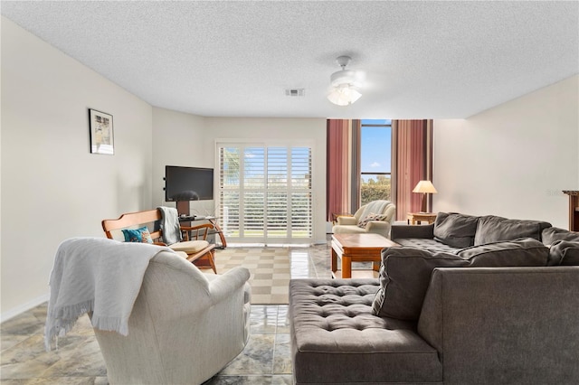 living room with a textured ceiling