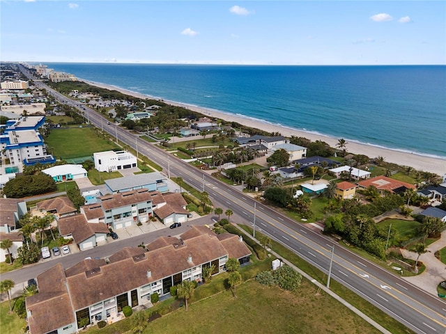 birds eye view of property featuring a water view and a view of the beach