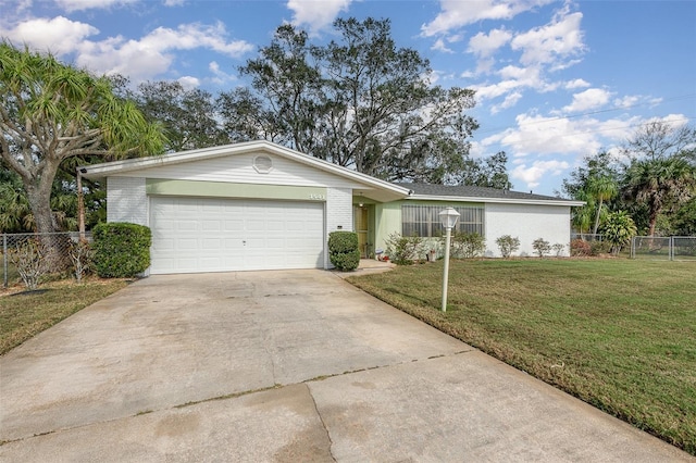 single story home featuring a garage and a front lawn