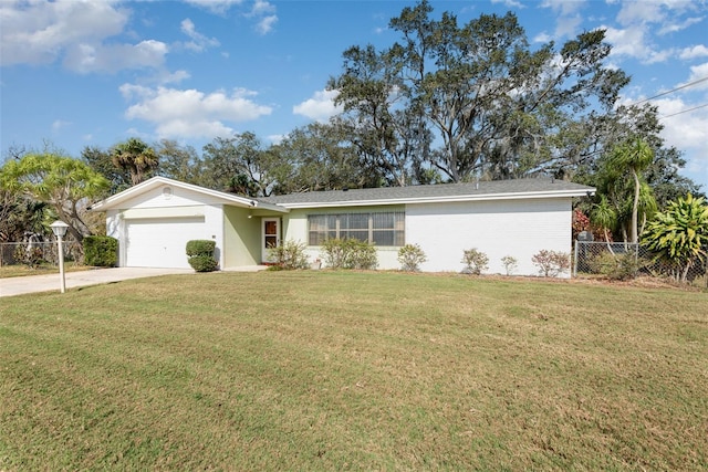 ranch-style home featuring a garage and a front lawn