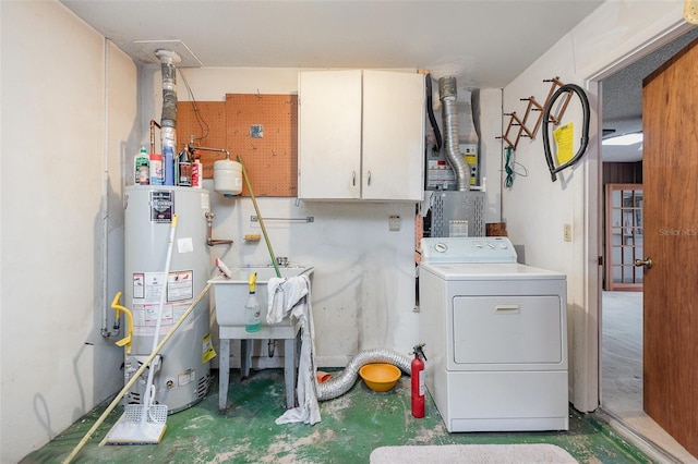 interior space featuring washer / clothes dryer, sink, cabinets, and water heater