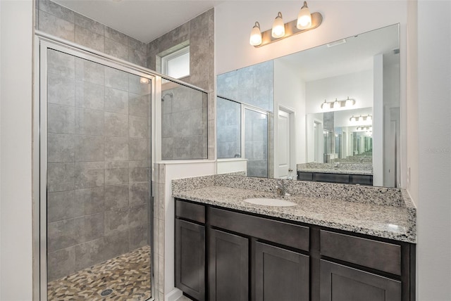 bathroom featuring vanity and walk in shower