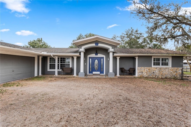 ranch-style house featuring a garage